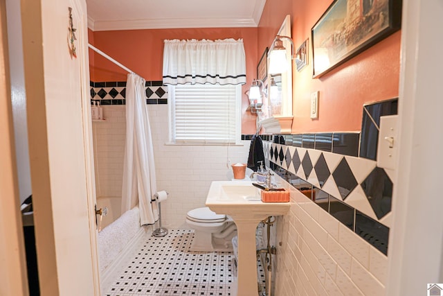 1931 Jefferson St, Paducah, KY 42001 - full bathroom featuring toilet, shower / bathtub combination with curtain, tile walls, crown molding, and a wainscoted wall