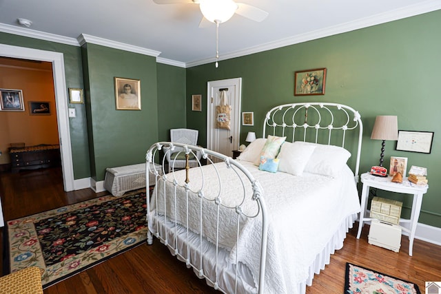 1931 Jefferson St, Paducah, KY 42001 - bedroom with wood finished floors, baseboards, crown molding, and a ceiling fan