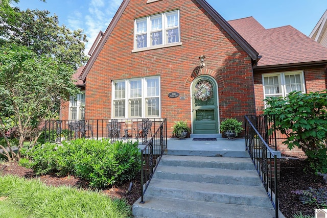 1931 Jefferson St, Paducah, KY 42001 - view of front of property featuring brick siding and a shingled roof