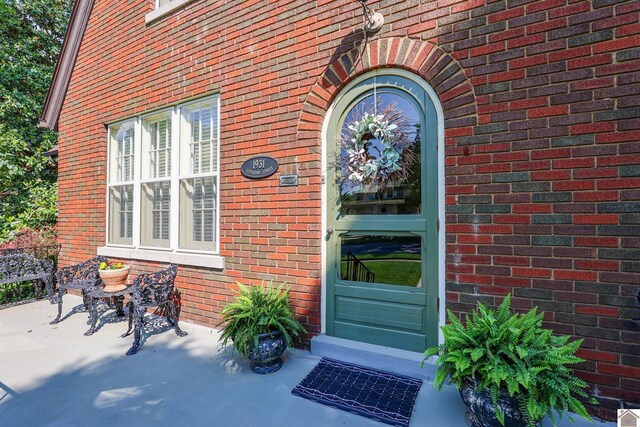 1931 Jefferson St, Paducah, KY 42001 - doorway to property featuring brick siding
