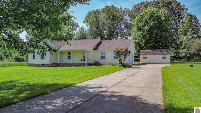200 Lions Den Ln, Paducah, KY 42003 - ranch-style home featuring crawl space, a shed, an outdoor structure, a front lawn, and concrete driveway