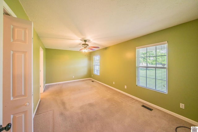 200 Lions Den Ln, Paducah, KY 42003 - spare room featuring light carpet, baseboards, and ceiling fan