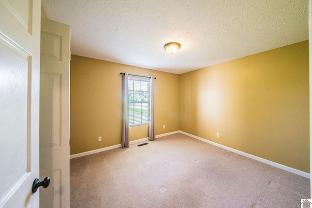 200 Lions Den Ln, Paducah, KY 42003 - spare room featuring light colored carpet, baseboards, and a textured ceiling