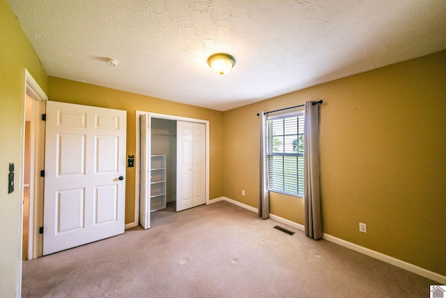 200 Lions Den Ln, Paducah, KY 42003 - unfurnished bedroom featuring a closet, carpet floors, and baseboards