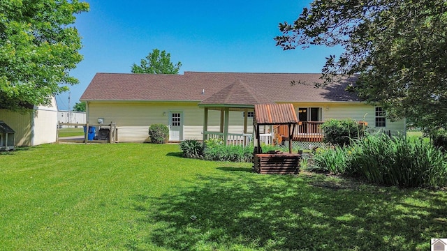 200 Lions Den Ln, Paducah, KY 42003 - back of property with a lawn, a wooden deck, and roof with shingles