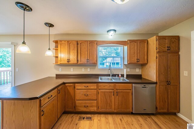 200 Lions Den Ln, Paducah, KY 42003 - kitchen with stainless steel dishwasher, a sink, dark countertops, and plenty of natural light