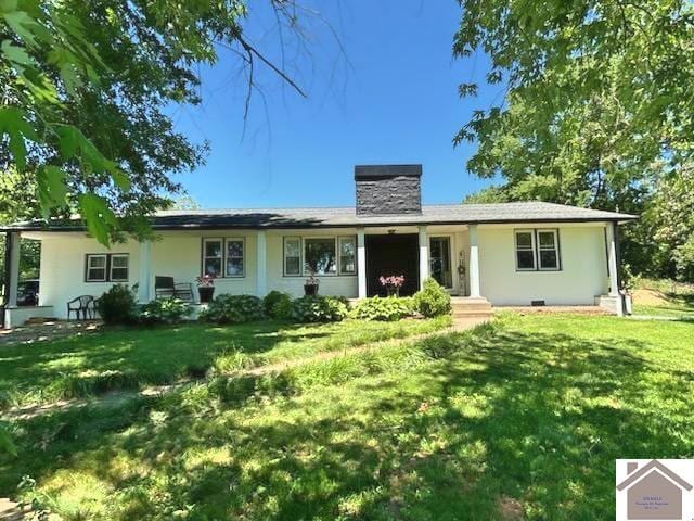 7262 State Route 94 E, Murray, KY 42071 - ranch-style home with a front lawn, a chimney, and stucco siding