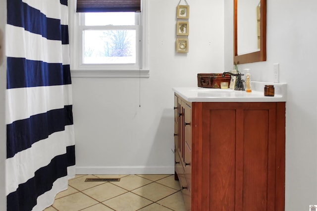 7262 State Route 94 E, Murray, KY 42071 - full bathroom featuring vanity, tile patterned flooring, baseboards, and a shower with curtain