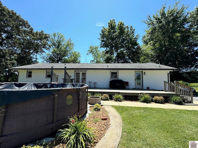 7262 State Route 94 E, Murray, KY 42071 - back of house with french doors, a lawn, and a wooden deck