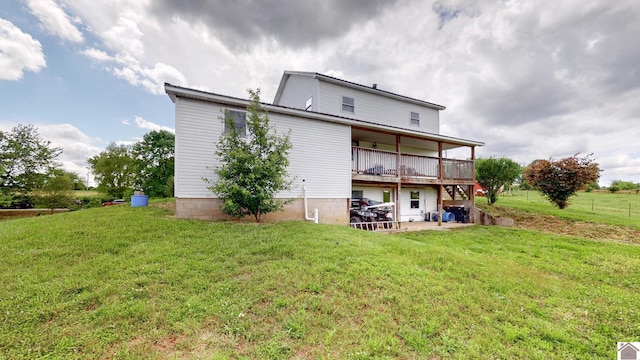 711 Rocky Rd, Fancy Farm, KY 42039 - rear view of house with a yard, metal roof, and a patio