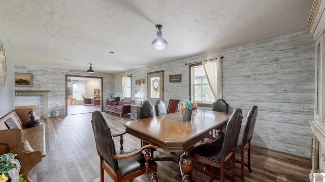 711 Rocky Rd, Fancy Farm, KY 42039 - dining area with hardwood / wood-style flooring and a fireplace