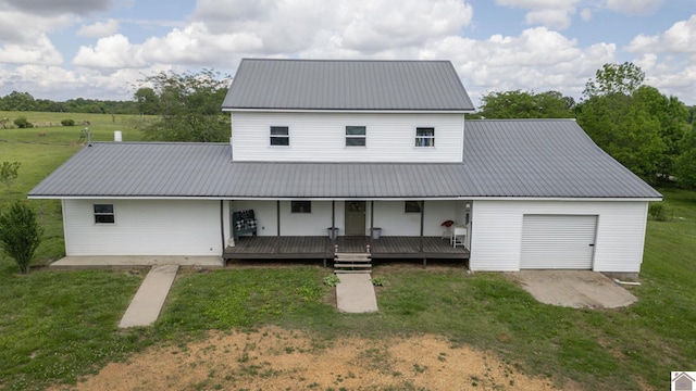711 Rocky Rd, Fancy Farm, KY 42039 - view of front of property with metal roof, a front lawn, and a garage