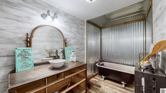 711 Rocky Rd, Fancy Farm, KY 42039 - full bathroom featuring wood finished floors, vanity, and a freestanding bath