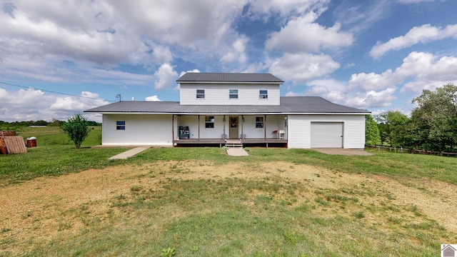 711 Rocky Rd, Fancy Farm, KY 42039 - view of front of home with a porch, metal roof, and a garage