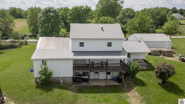 711 Rocky Rd, Fancy Farm, KY 42039 - rear view of property with a lawn and a patio