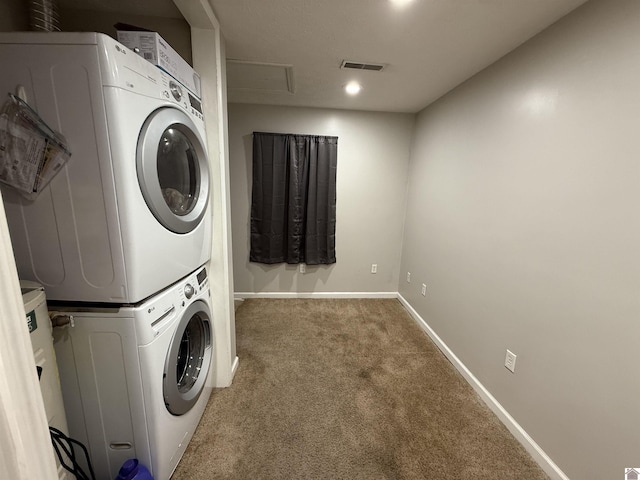 laundry room with stacked washing machine and dryer, carpet flooring, baseboards, and recessed lighting