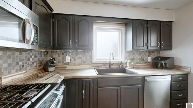 3500 Cairo, Paducah, KY 42001 - kitchen with stainless steel appliances, a sink, butcher block counters, and tasteful backsplash
