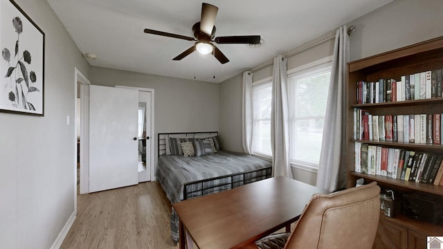 3500 Cairo, Paducah, KY 42001 - bedroom with light wood-style flooring, baseboards, a ceiling fan, and a desk