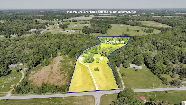 5109 S Rd, Cadiz, KY 42211 - aerial view of property and surrounding area featuring property boundaries highlighted and a heavily wooded area