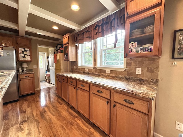 5109 S Rd, Cadiz, KY 42211 - kitchen featuring freestanding refrigerator, dark wood-style floors, beamed ceiling, brown cabinetry, and tasteful backsplash