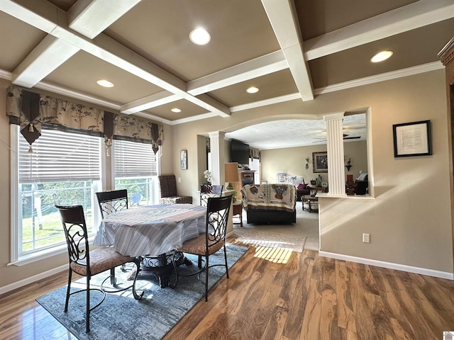 5109 S Rd, Cadiz, KY 42211 - dining space with decorative columns, coffered ceiling, arched walkways, baseboards, and beam ceiling