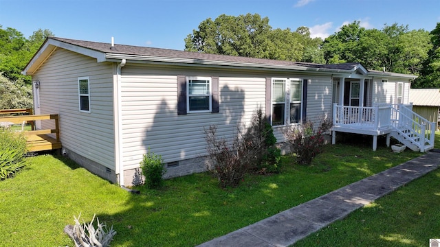 5109 S Rd, Cadiz, KY 42211 - view of front facade featuring crawl space, a wooden deck, and a front yard