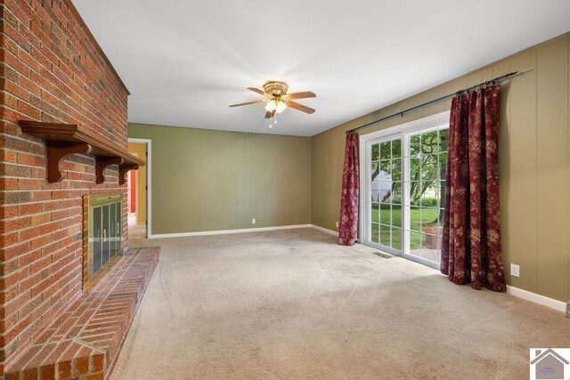 1906 Gatesborough Cir, Murray, KY 42071 - unfurnished living room with carpet flooring, baseboards, and a fireplace