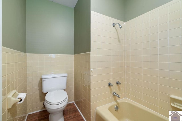 1906 Gatesborough Cir, Murray, KY 42071 - bathroom featuring wood finished floors, toilet, tile walls, bathtub / shower combination, and wainscoting