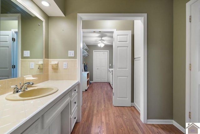 1906 Gatesborough Cir, Murray, KY 42071 - bathroom featuring a ceiling fan, wood finished floors, vanity, and baseboards