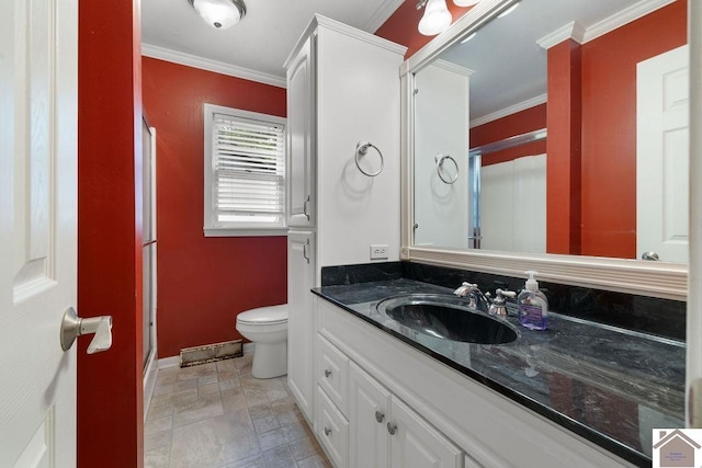 1906 Gatesborough Cir, Murray, KY 42071 - bathroom with crown molding, toilet, vanity, baseboards, and a stall shower