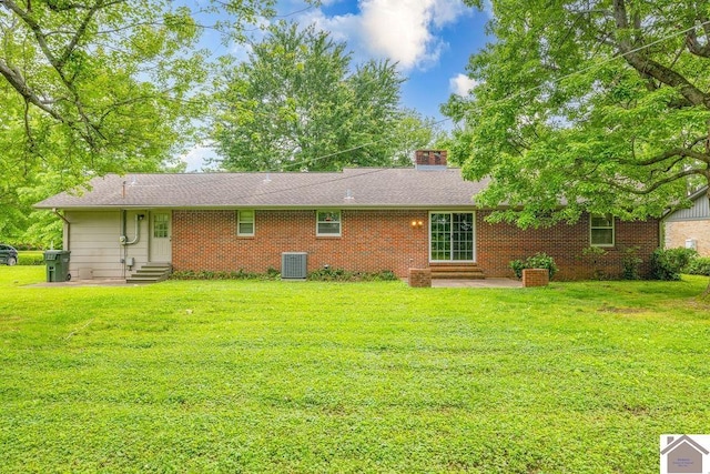 1906 Gatesborough Cir, Murray, KY 42071 - rear view of property with entry steps, cooling unit, a lawn, a patio area, and a chimney