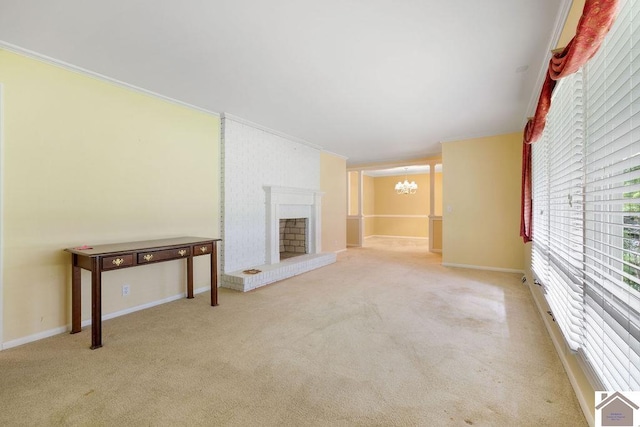 1906 Gatesborough Cir, Murray, KY 42071 - unfurnished living room with a chandelier, carpet flooring, crown molding, a fireplace, and baseboards