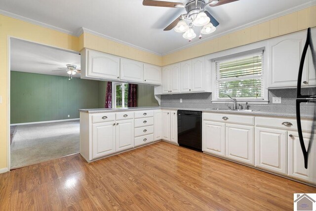 1906 Gatesborough Cir, Murray, KY 42071 - kitchen with black dishwasher, ceiling fan, a sink, light countertops, and plenty of natural light