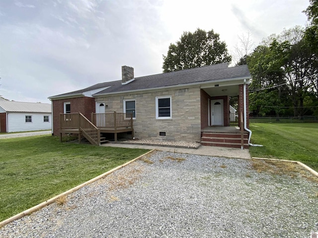 3827 Howle, Paducah, KY 42003 - view of front of home featuring a chimney, stone siding, a front lawn, a deck, and roof with shingles