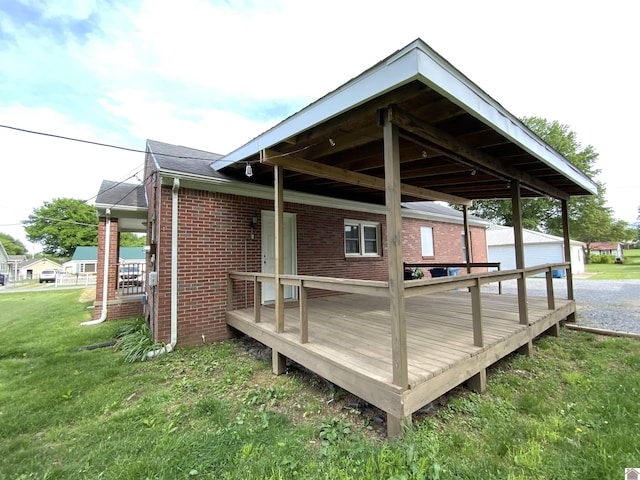3827 Howle, Paducah, KY 42003 - view of side of home with brick siding, a yard, and a deck