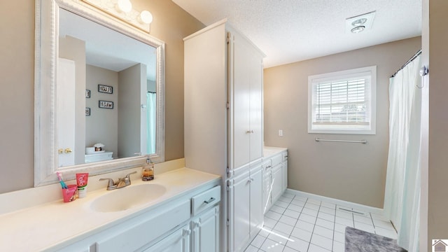 206 Metcalf Ln, Almo, KY 42020 - bathroom featuring vanity, tile patterned floors, baseboards, toilet, and a textured ceiling