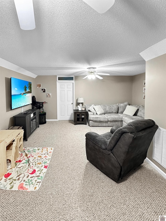 206 Metcalf Ln, Almo, KY 42020 - living room featuring ceiling fan, carpet flooring, baseboards, and a textured ceiling