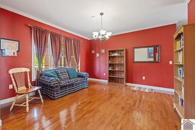 2007 Atkins Way, Murray, KY 42071 - living area with a chandelier, light wood-style flooring, baseboards, and crown molding