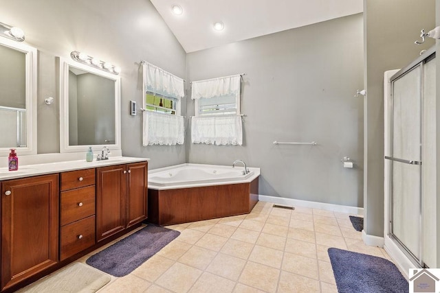 2007 Atkins Way, Murray, KY 42071 - bathroom with vaulted ceiling, vanity, a stall shower, tile patterned flooring, and a bath