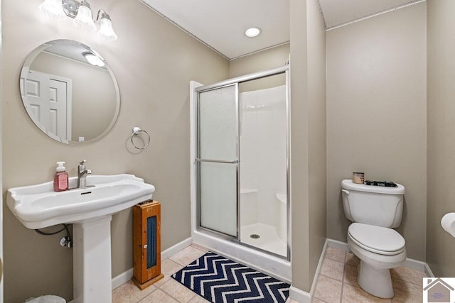 2007 Atkins Way, Murray, KY 42071 - full bath featuring a shower stall, tile patterned floors, toilet, and baseboards
