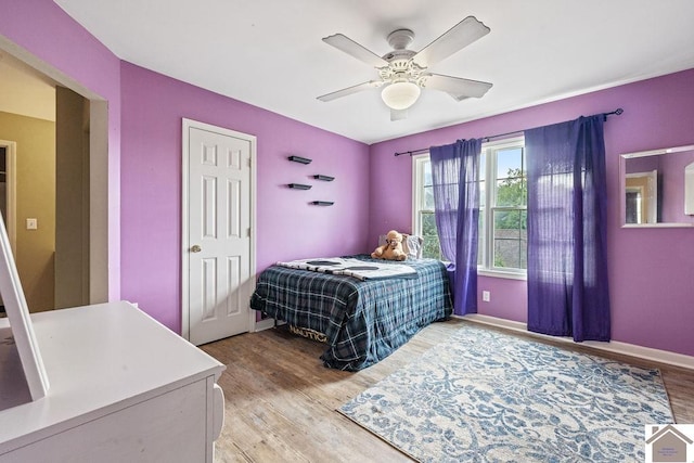 2007 Atkins Way, Murray, KY 42071 - bedroom with light wood-style floors, ceiling fan, and baseboards