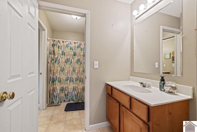 2007 Atkins Way, Murray, KY 42071 - bathroom featuring vanity, tile patterned flooring, curtained shower, and baseboards