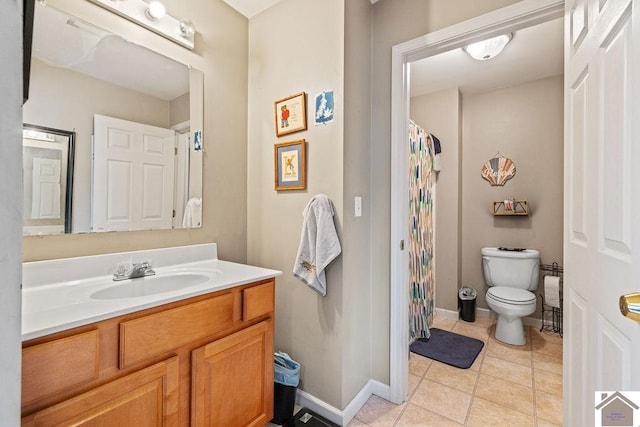 2007 Atkins Way, Murray, KY 42071 - bathroom with toilet, vanity, baseboards, tile patterned floors, and a shower with shower curtain
