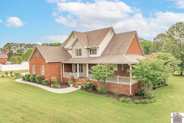 2007 Atkins Way, Murray, KY 42071 - view of front of house with brick siding, a porch, and a front lawn