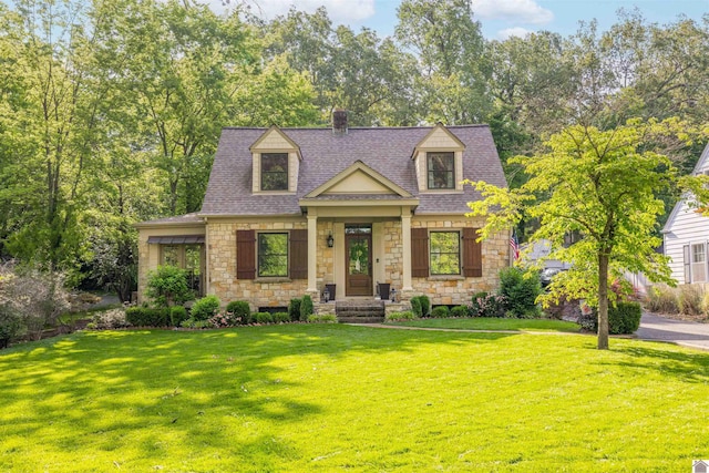 341 Friedman Ave, Paducah, KY 42001 - cape cod home with stone siding, a chimney, a front yard, and roof with shingles