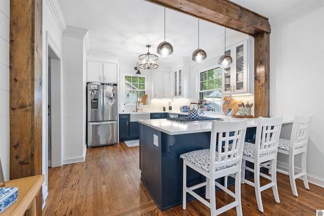 341 Friedman Ave, Paducah, KY 42001 - kitchen featuring stainless steel appliances, blue cabinetry, a peninsula, white cabinetry, and tasteful backsplash