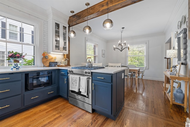 341 Friedman Ave, Paducah, KY 42001 - kitchen featuring stainless steel range with gas cooktop, blue cabinetry, a peninsula, light countertops, and glass insert cabinets