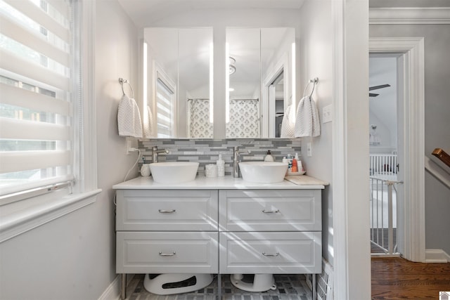 341 Friedman Ave, Paducah, KY 42001 - full bathroom with backsplash, wood finished floors, double vanity, and baseboards