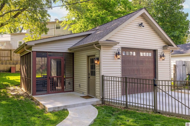 341 Friedman Ave, Paducah, KY 42001 - view of front of house featuring a sunroom, fence, and a shingled roof