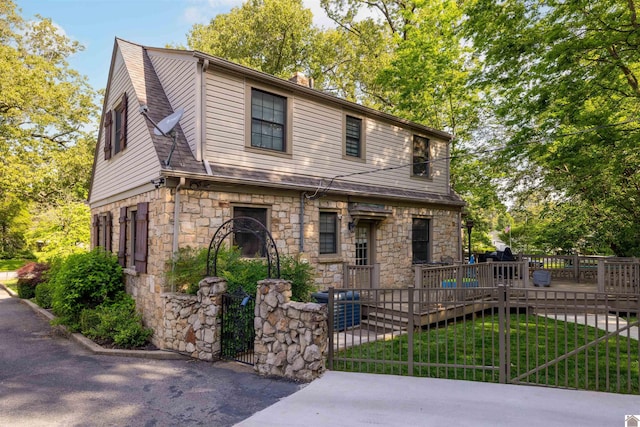 341 Friedman Ave, Paducah, KY 42001 - view of front of house with a deck, a fenced front yard, stone siding, and a gate